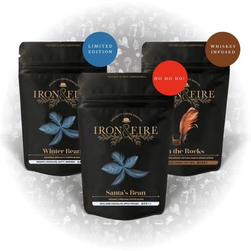 image of 3 black bags of coffee with Christmas decorations