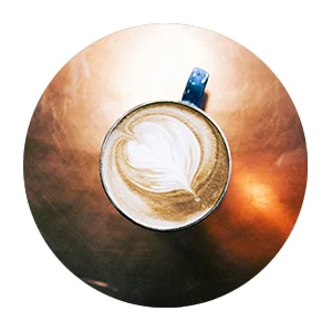 arial view of a flat white coffee on a copper table top